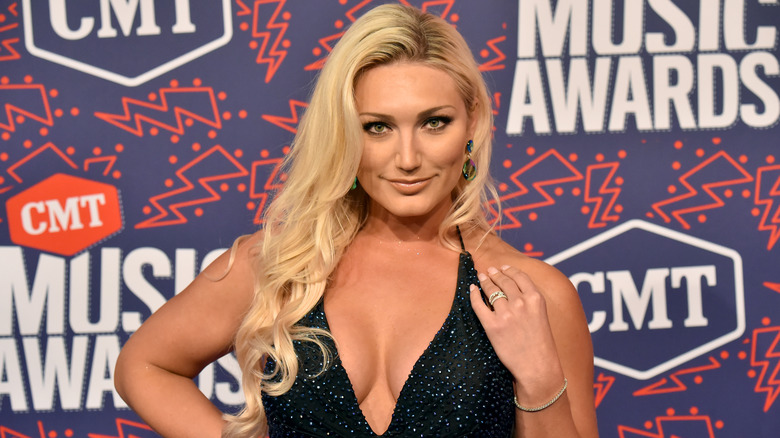 Brooke Hogan posing on the red carpet at the CMT Awards