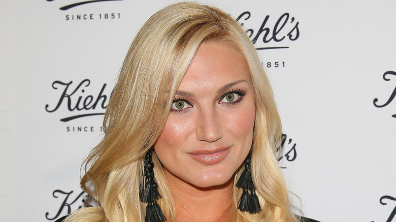 Brooke Hogan posing on the red carpet at Kiehl's event