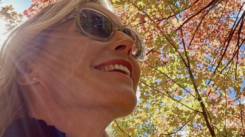 Candice Olson outdoors under a tree