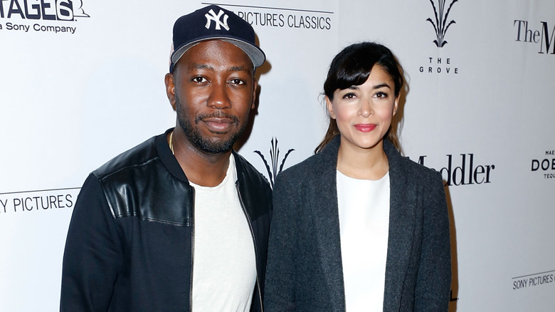 Lamorne Morris and Hannah Simone on step-and-repeat