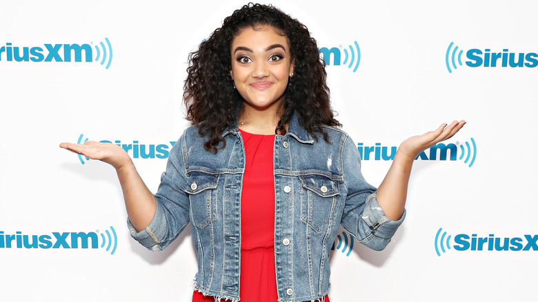 Laurie Hernandez smiles and shrugs 