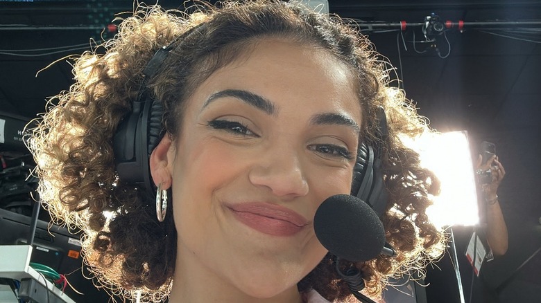 Laurie Hernandez smiling with headset 