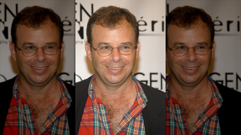 Rick Moranis with his plaid shirt unbuttoned