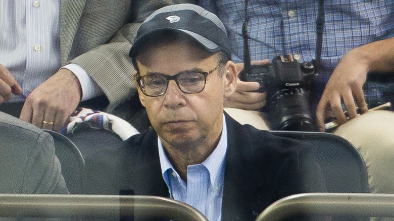 Rick Moranis looking upset at a hockey game