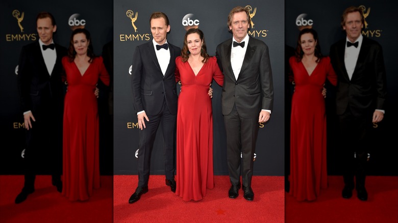 Tom Hiddleston, Olivia Colman, and Hugh Laurie posing at the 2016 Emmy Awards in Los Angeles.