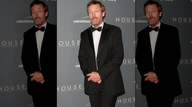 Hugh Laurie posing at the series finale wrap party of "House" in 2012.