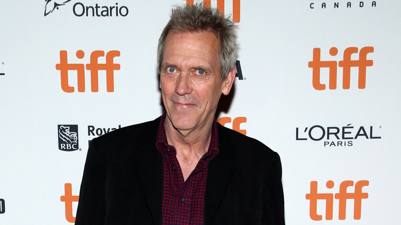 Hugh Laurie smiling at "The Personal History of David Copperfield" premiere in Toronto, 2019.