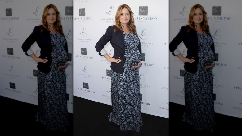 Jenna Fischer posing at a maternity clothing launch