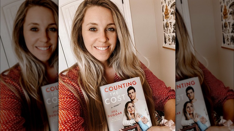 Jill Duggar Dillard holding book Counting the Cost