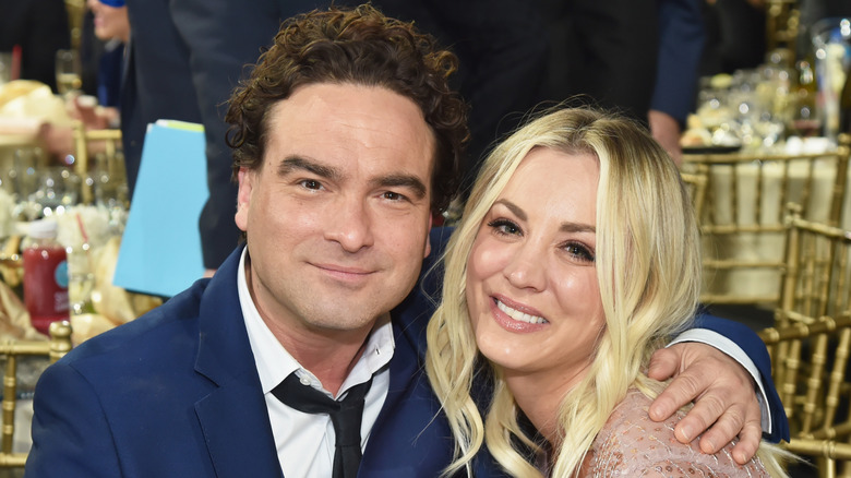 Johnny Galecki holding Kaley Cuoco in a photo