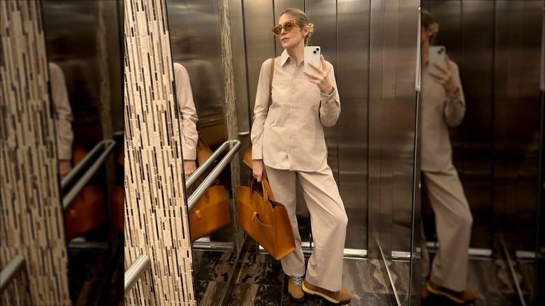Kelly Rutherford wearing a beige ensemble in her building apartment
