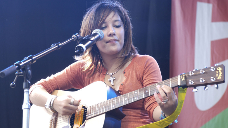 Lalaine Vergara-Paras playing guitar