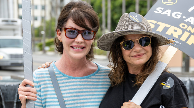 Lara Flynn Boyle and Laura San Giacomo smiling