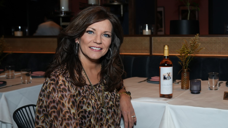 Martina McBride sitting at a table