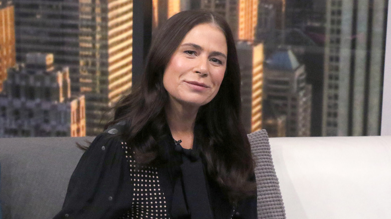 Maura Tierney on a sofa