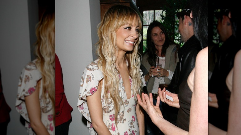 Nicole Richie talking to someone