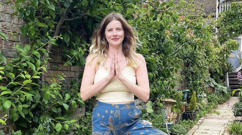 Rachel Hurd-Wood striking a yoga pose