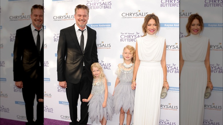 Eric Dane and Rebecca Gayheart smiling with their daughters 