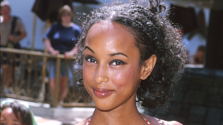 Trina McGee smiling at a red carpet event