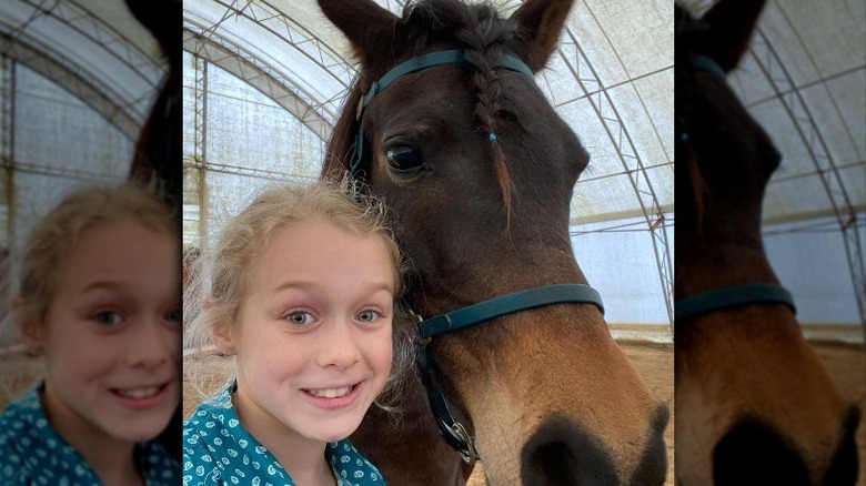 Chanlee Dunlap smiling with horse