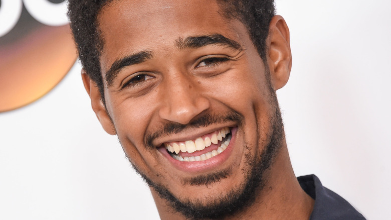 Alfred Enoch smiling