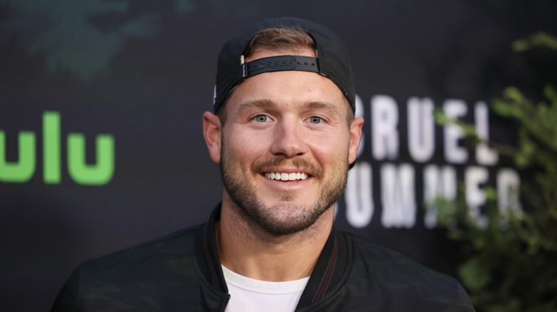 Colton Underwood in backwards hat 