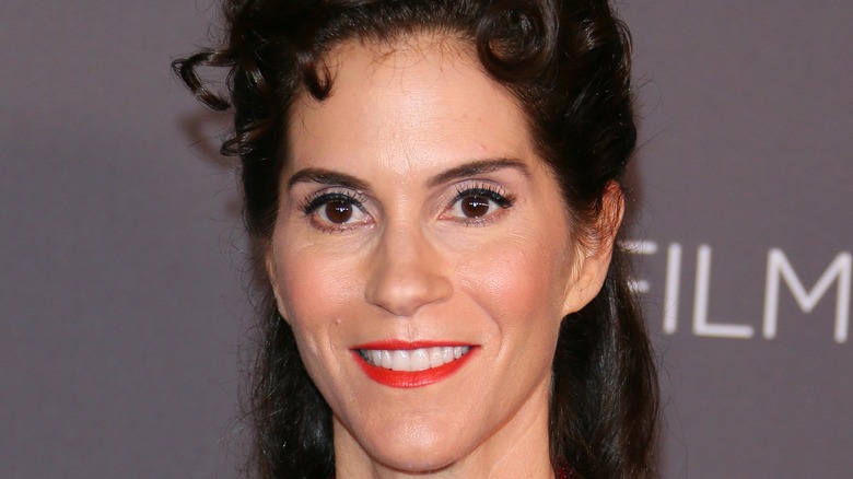 Jami Gertz with a curly updo