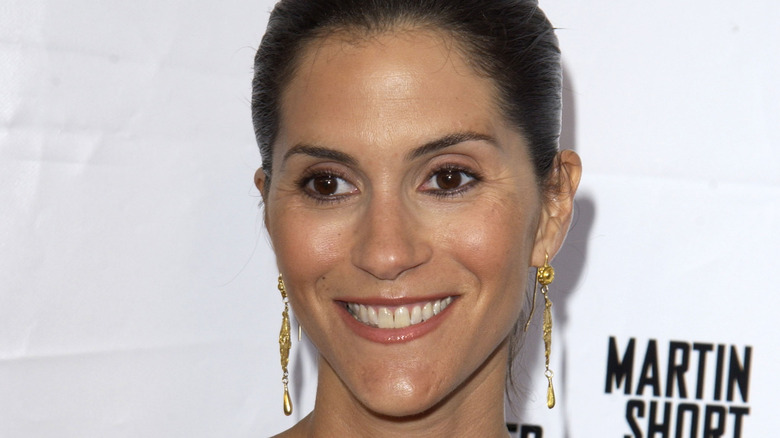 Jami Gertz smiling on the red carpet