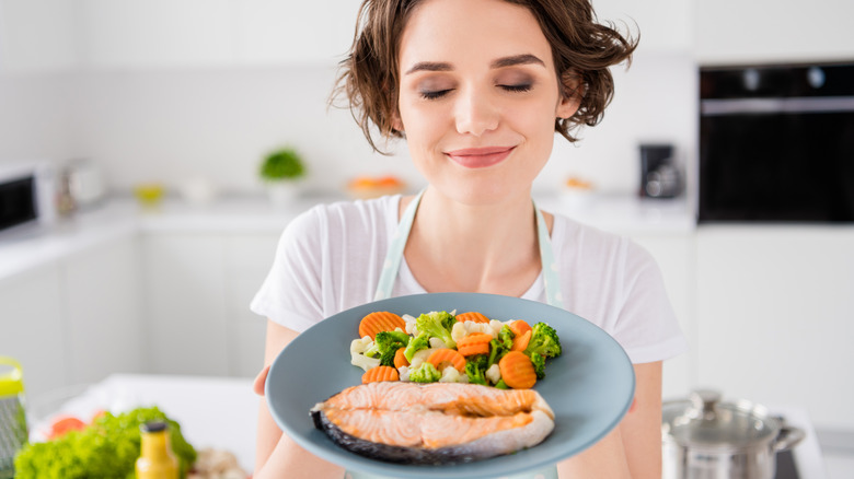 woman eating salmon