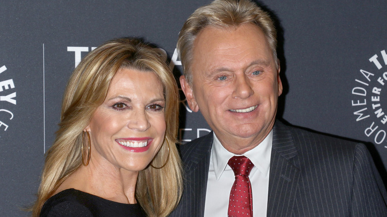 Vanna White and Pat Sajak smiling