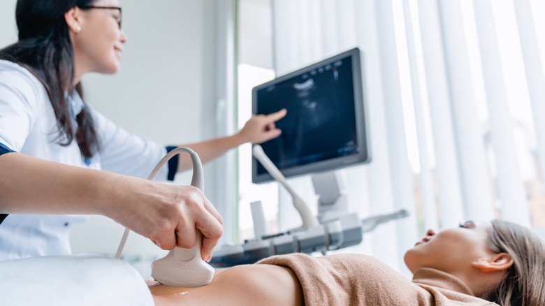 woman looking at ultrasound screen