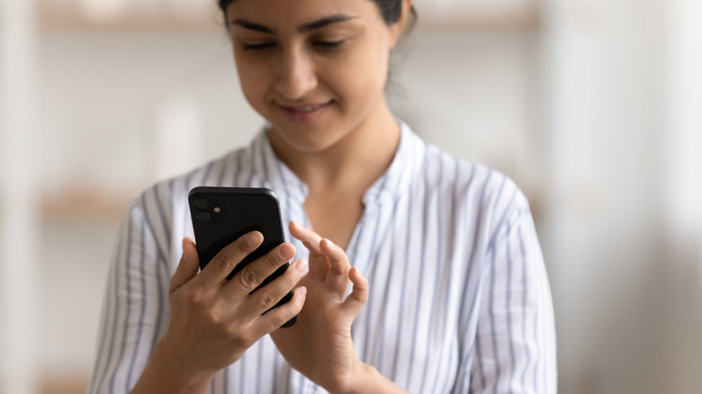 woman sending text