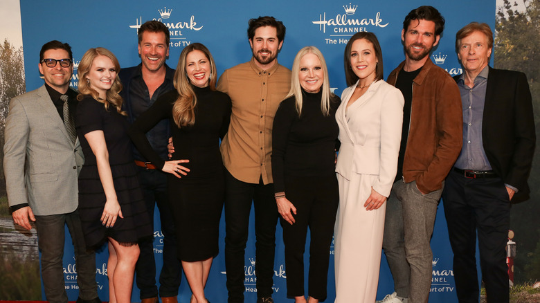 The stars of When Calls the Heart pose together at an event