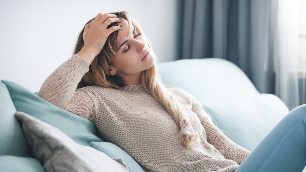 Tired woman on couch