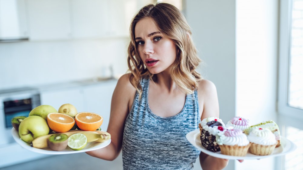 Woman holding plates of food