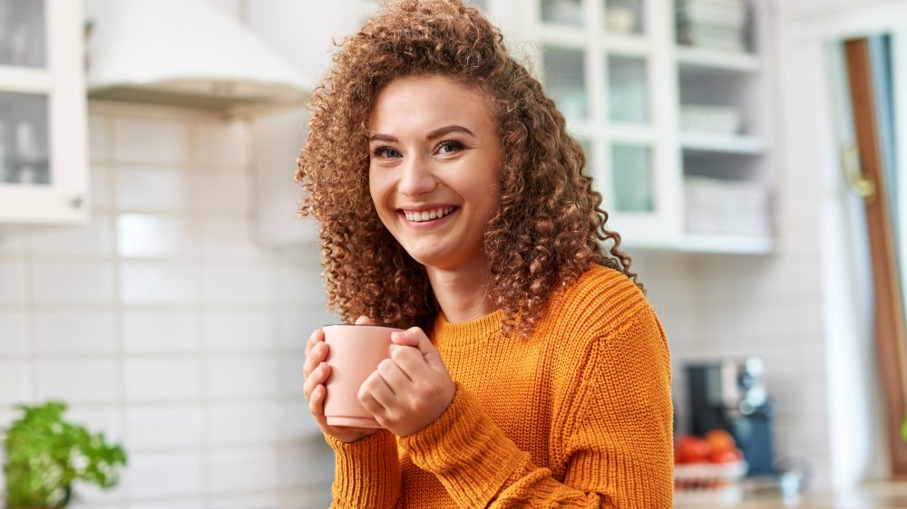 happy woman drinking chai tea