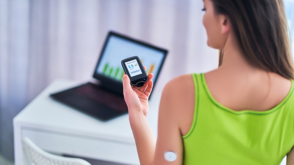 A woman monitoring her blood sugar