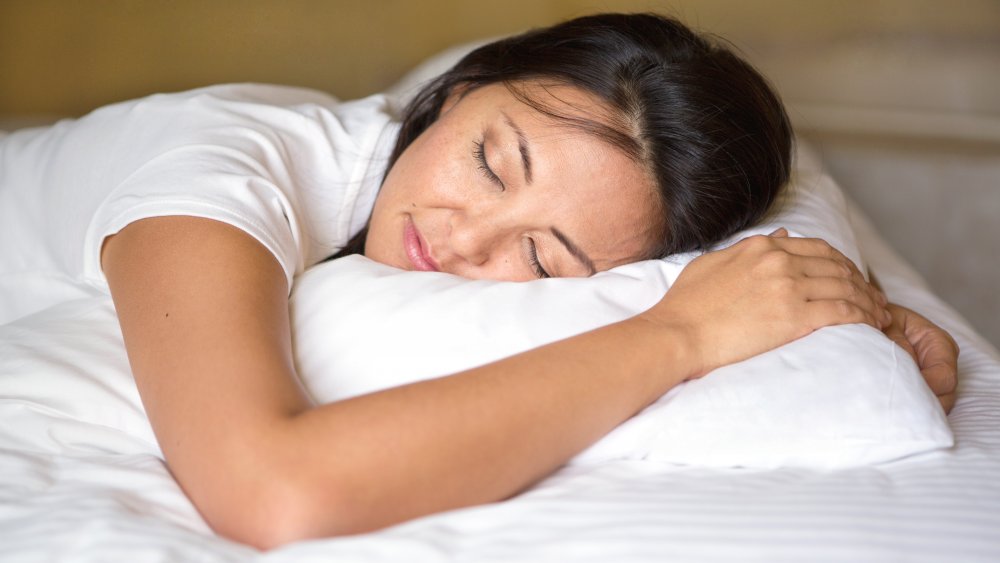 A woman sleeping in bed