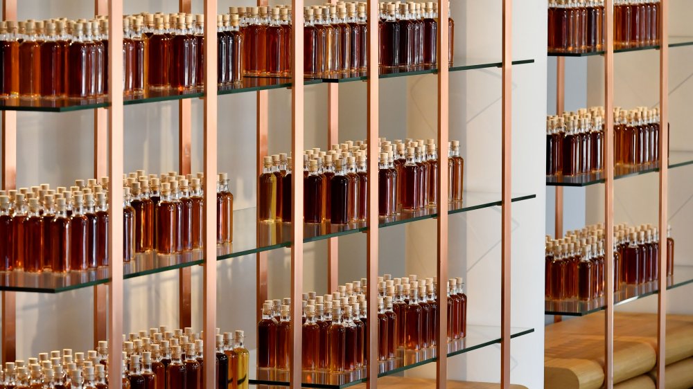 Cognac bottles in a wall display