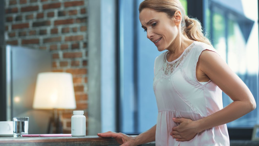 woman having stomach pain