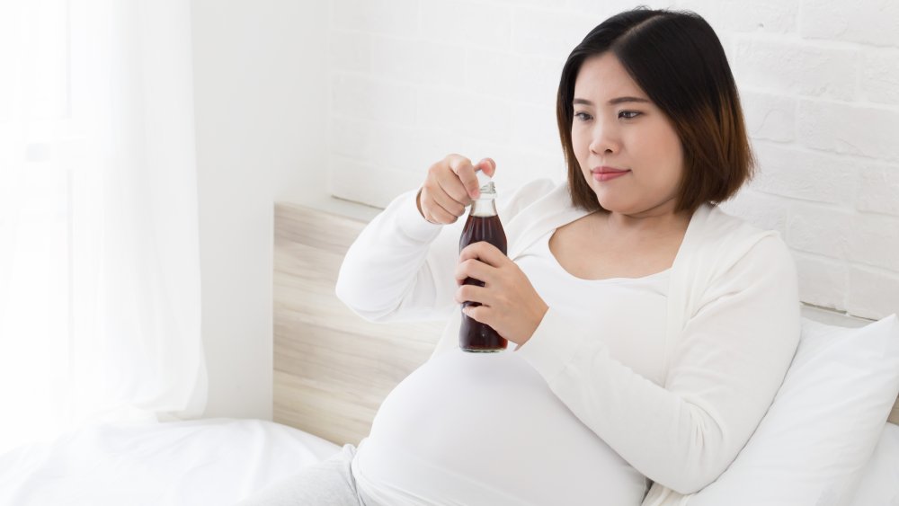 woman drinking diet coke while pregnant