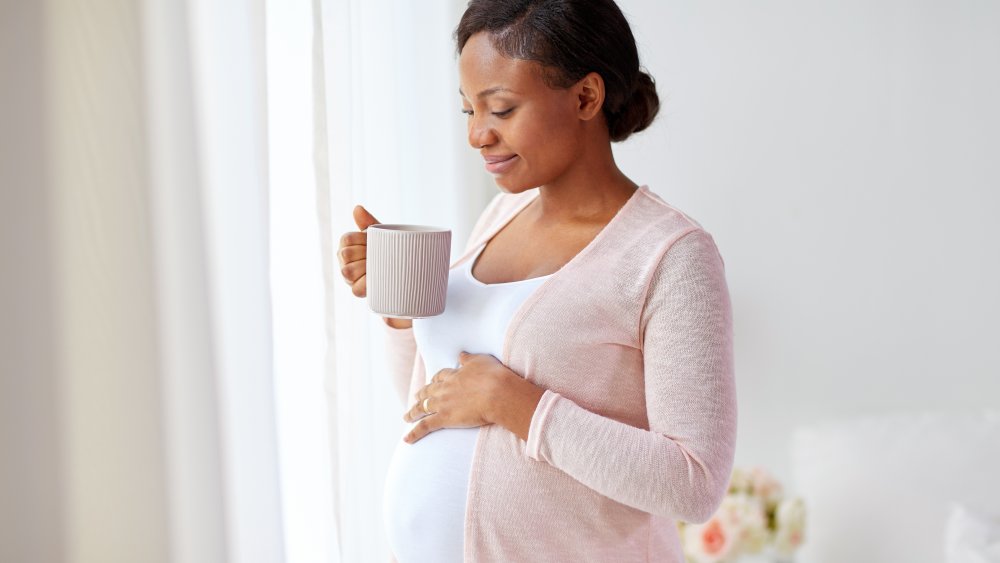 pregnant woman drinking ginger tea