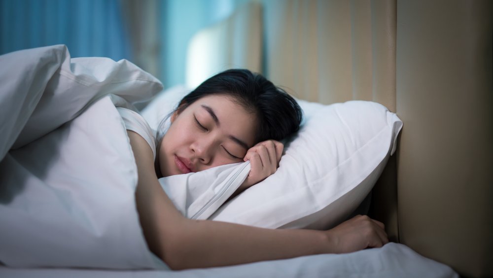 A woman asleep in bed