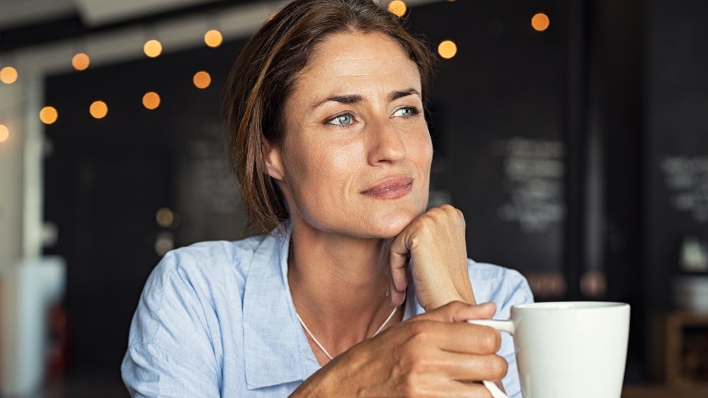 woman drinking from mug