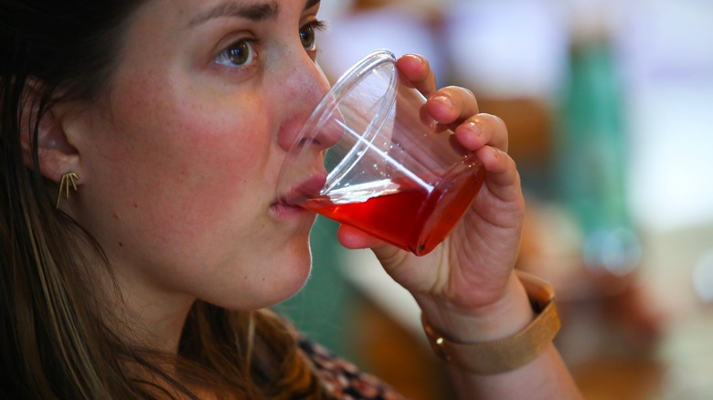 Woman drinking kombucha tea 