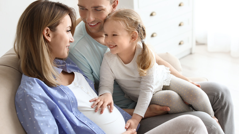 Pregnant woman with family