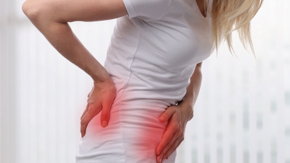 woman in kidney stone pain