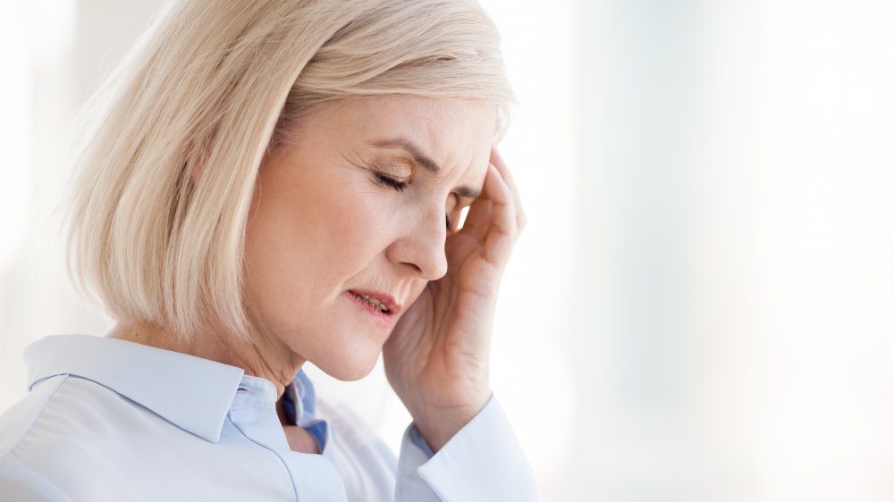 Woman holding head