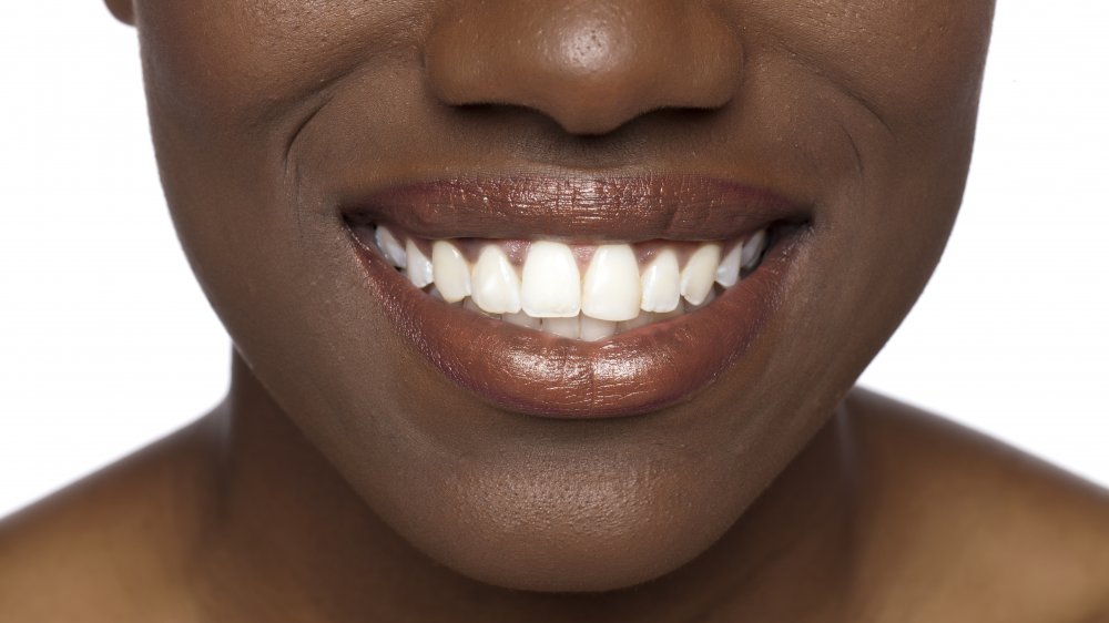 A woman's smiling mouth, close-up