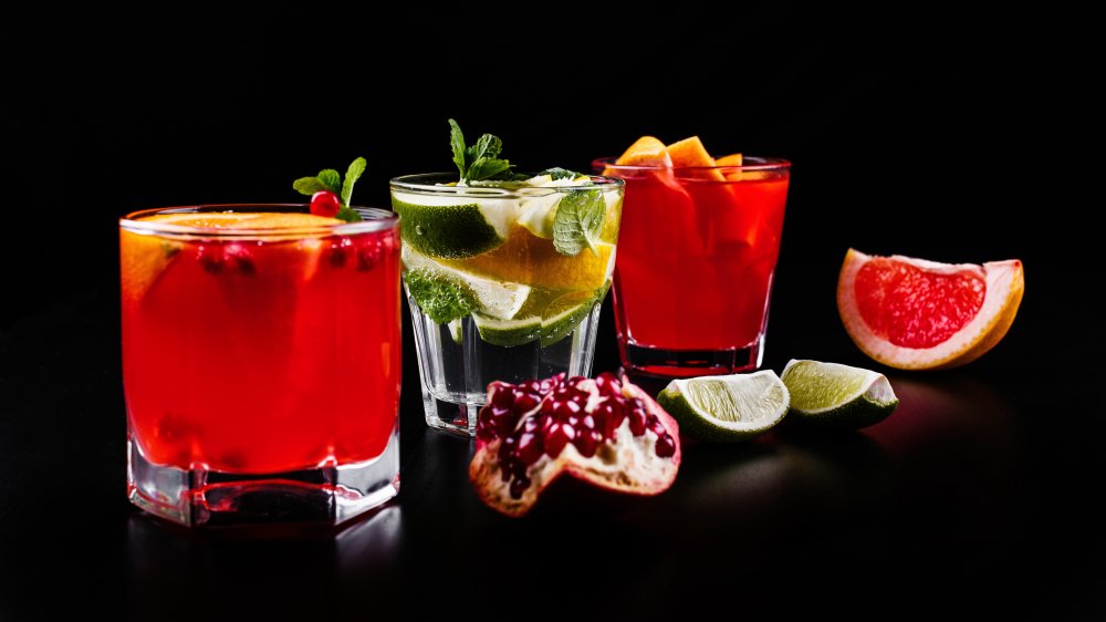 Cocktails and fruit on a black background